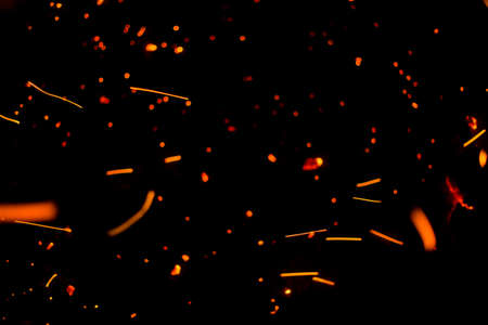 Flame of fire with sparks on a black background