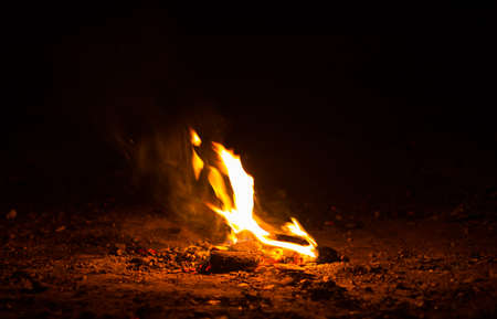 Flame of fire with sparks on a black background