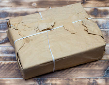 new books wrapped in brown paper on the table