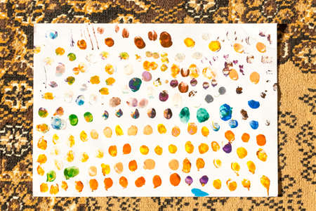 children with paint apply their own imprint on paper
