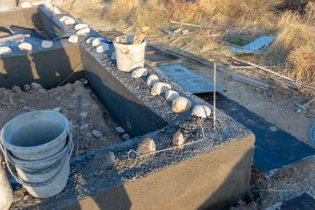 Workers lay the foundation for a new home