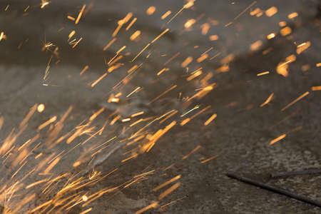 Bright blue and yellow sparks on a black background. Magical ligの写真素材