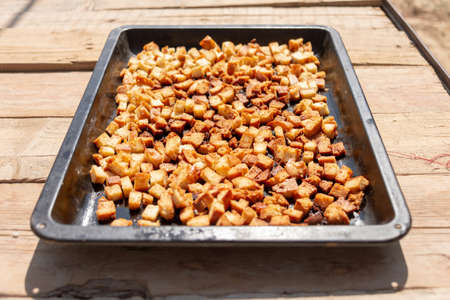 square bread crumbs of dry bread on iron utensils for an ovenの写真素材