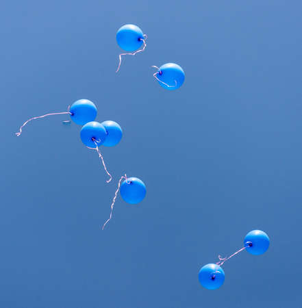 blue balls of gel on a blue skyの写真素材