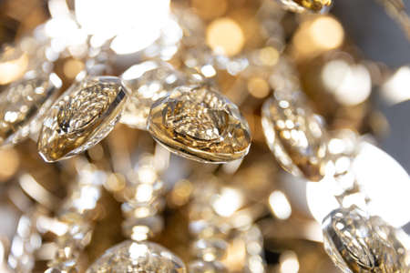 Close up on crystal of contemporary chandelier, is a branched ornamental light fixture designed to be mounted on ceilings or wallsの写真素材
