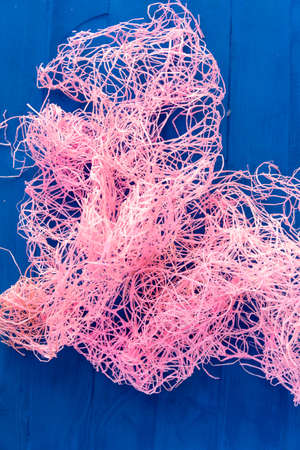 Background of textured fishing net on a blue background.の写真素材