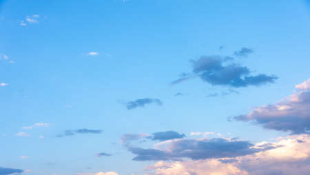 Blue sky with white clouds at sunsetの写真素材