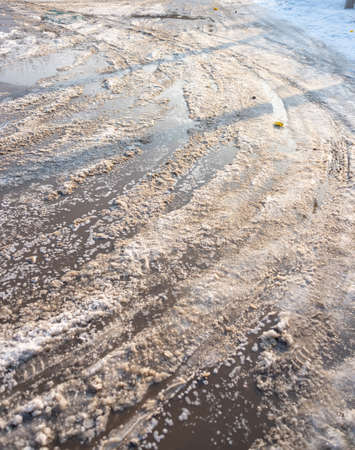 Dirty snowy streets of the cityの写真素材