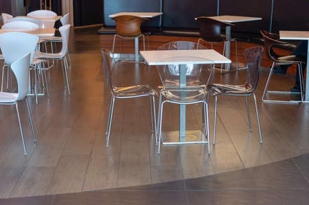 White chairs in a supermarket for customers to drink coffee and relaxの写真素材
