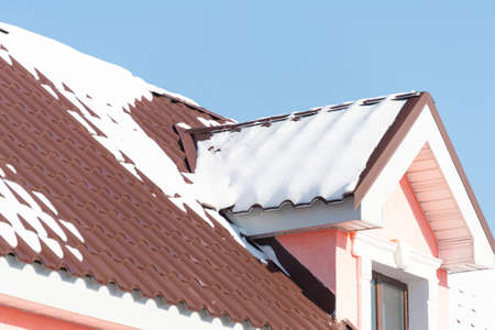 Winter snow on the roofの写真素材