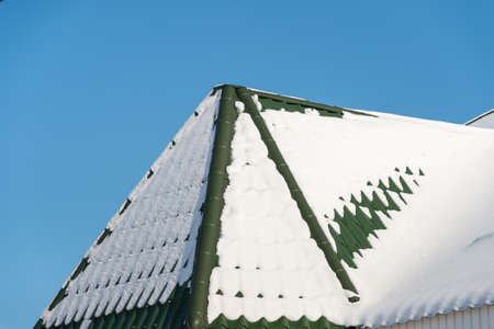 Winter snow on the roofの写真素材