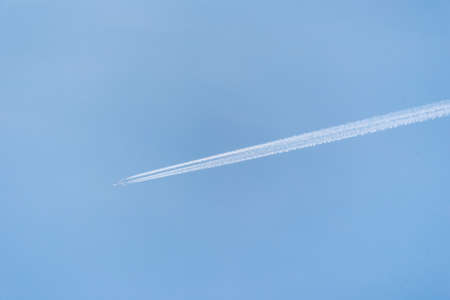 The liner flies in the blue sky and leaves a traceの写真素材