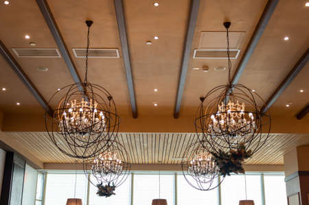 Interior design round lamp frame in cafe. Lighting lamp under the ceiling. Interior Designの写真素材