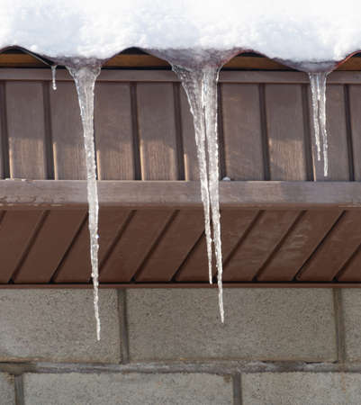 Ice icicles on the roofの写真素材