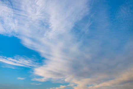 Blue sky with white clouds at sunsetの写真素材