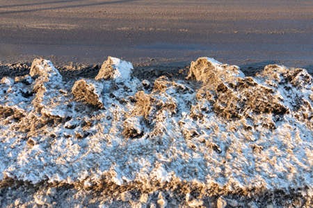 dirty snowy streets of the cityの写真素材