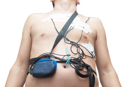 A man wears a Holter device, a device for daily ECG monitoring. Treatment of heart defects
