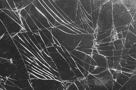 Broken glass on a black background, object background design textureの写真素材