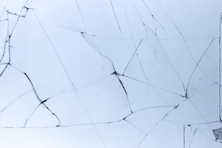 Broken glass on blue background, object background design textureの写真素材
