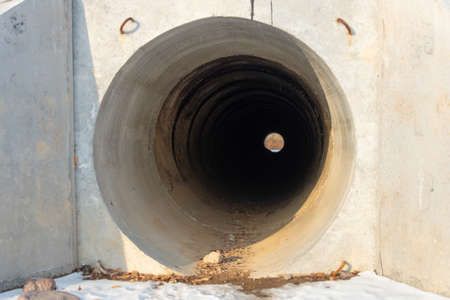 Drainage, sewer pipes, concrete pipes, leading water under the roadの写真素材