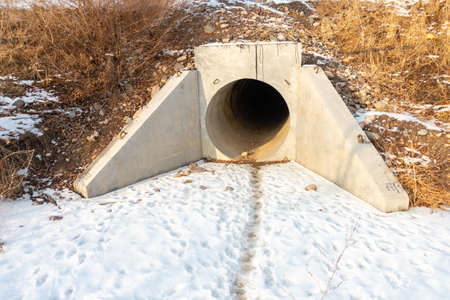 Drainage, sewer pipes, concrete pipes, leading water under the roadの写真素材