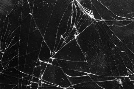 Broken glass on a black background, object background design textureの写真素材