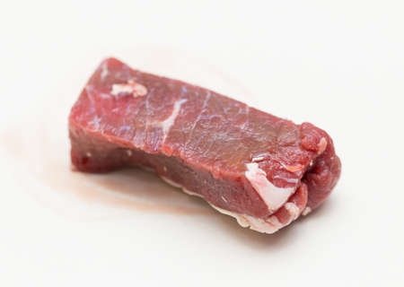 slices of raw meat on a white backgroundの写真素材