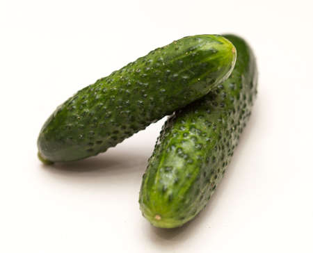 two cucumbers on a white backgroundの写真素材