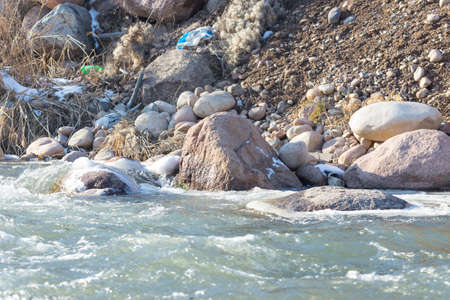 Mountain river and stones in winterの写真素材