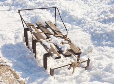 Old sled on snowの写真素材