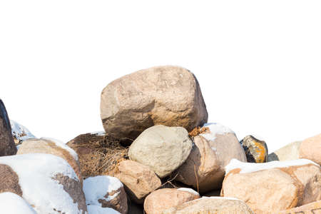 huge stones in the snow of different shapes and sizes, natural stone, winter backgroundの写真素材