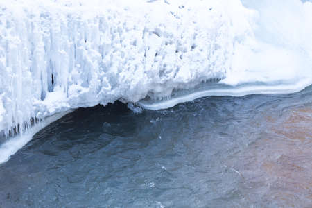 Mountain river and stones in winterの写真素材
