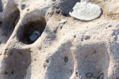 unusual stone background with holesの写真素材