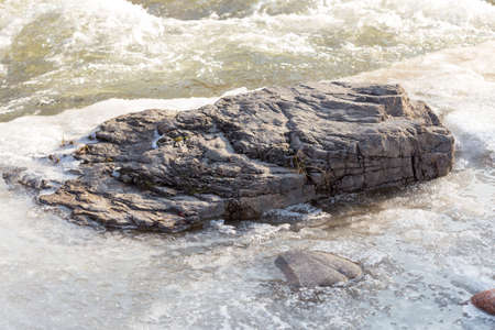 Mountain river and stones in winterの写真素材