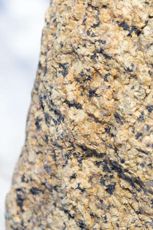 Stone surface of a dark yellow sandstone, background, textureの写真素材