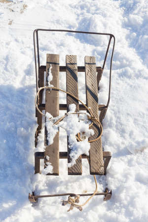Old sled on snowの写真素材