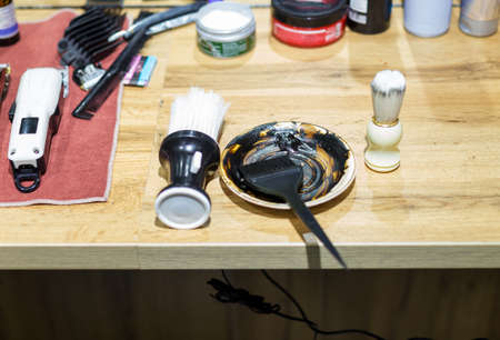 Hairdressing tools hair dye brush on the tableの写真素材