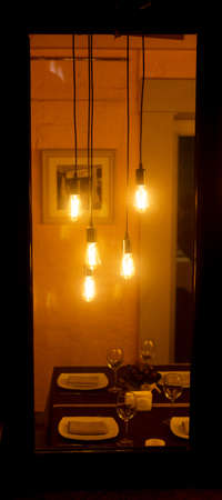 Decorative light bulbs in vintage Edison style in a cozy cafeの写真素材