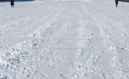 Traces of people in fresh white snowの写真素材