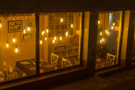 Decorative light bulbs in vintage Edison style in a cozy cafeの写真素材