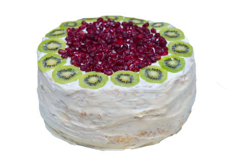 fruit cake with dairy cream and fruit on a white backgroundの写真素材