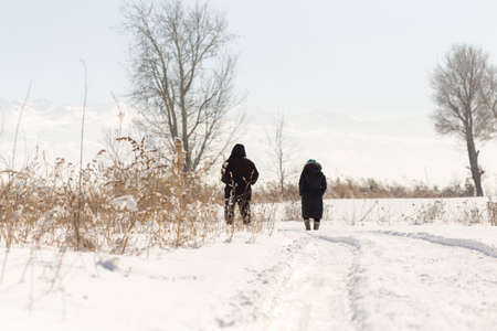Elderly couple walking in winterの写真素材