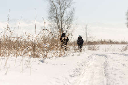 Elderly couple walking in winterの写真素材