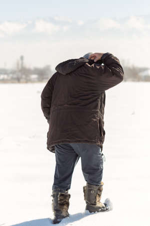 Elderly couple walking in winterの写真素材
