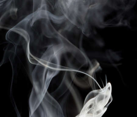 Abstract white smoke on black backgroundの写真素材