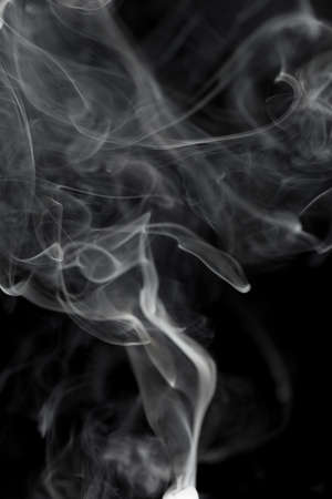 Abstract white smoke on black backgroundの写真素材