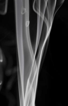 Abstract white smoke on black backgroundの写真素材