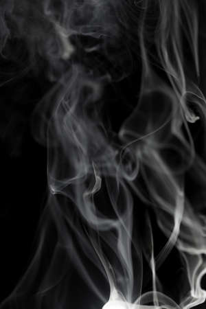 Abstract white smoke on black backgroundの写真素材