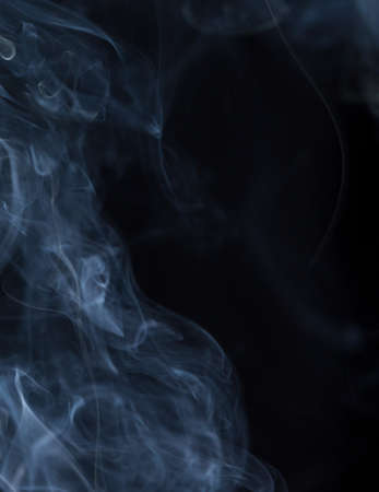 Abstract white smoke on black backgroundの写真素材