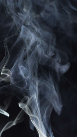 Abstract white smoke on black backgroundの写真素材
